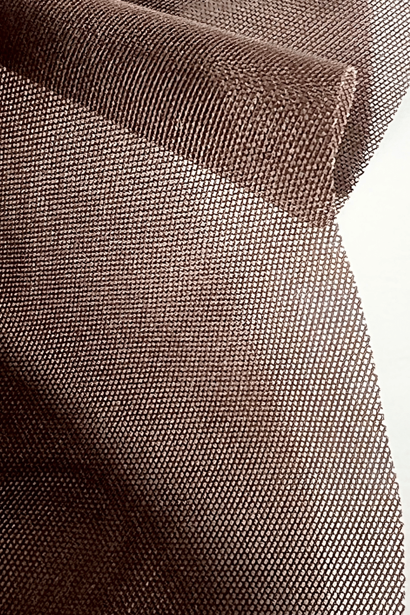 Close up of powernet fabric used in Ender Legard backless Bodysuits