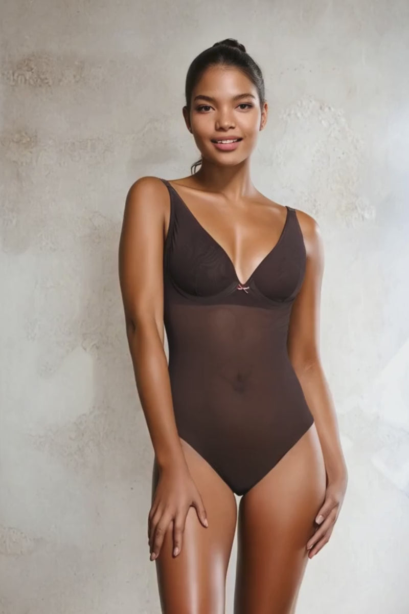 Video of a model wearing an Ender Legard JONI backless bodysuit in colour brown as seen from a front view