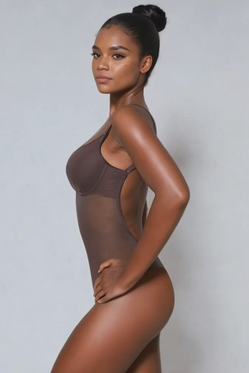 Video of a model wearing an Ender Legard MAE backless bodysuit in colour espresso as seen from the side